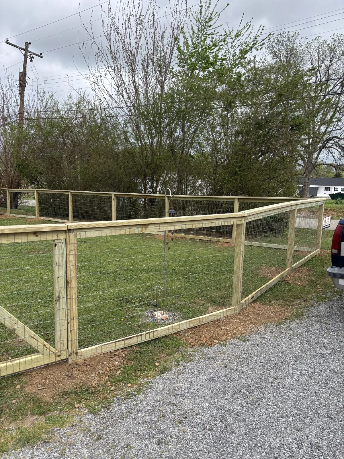 Completed Cornerstone wood-framed welded wire fence