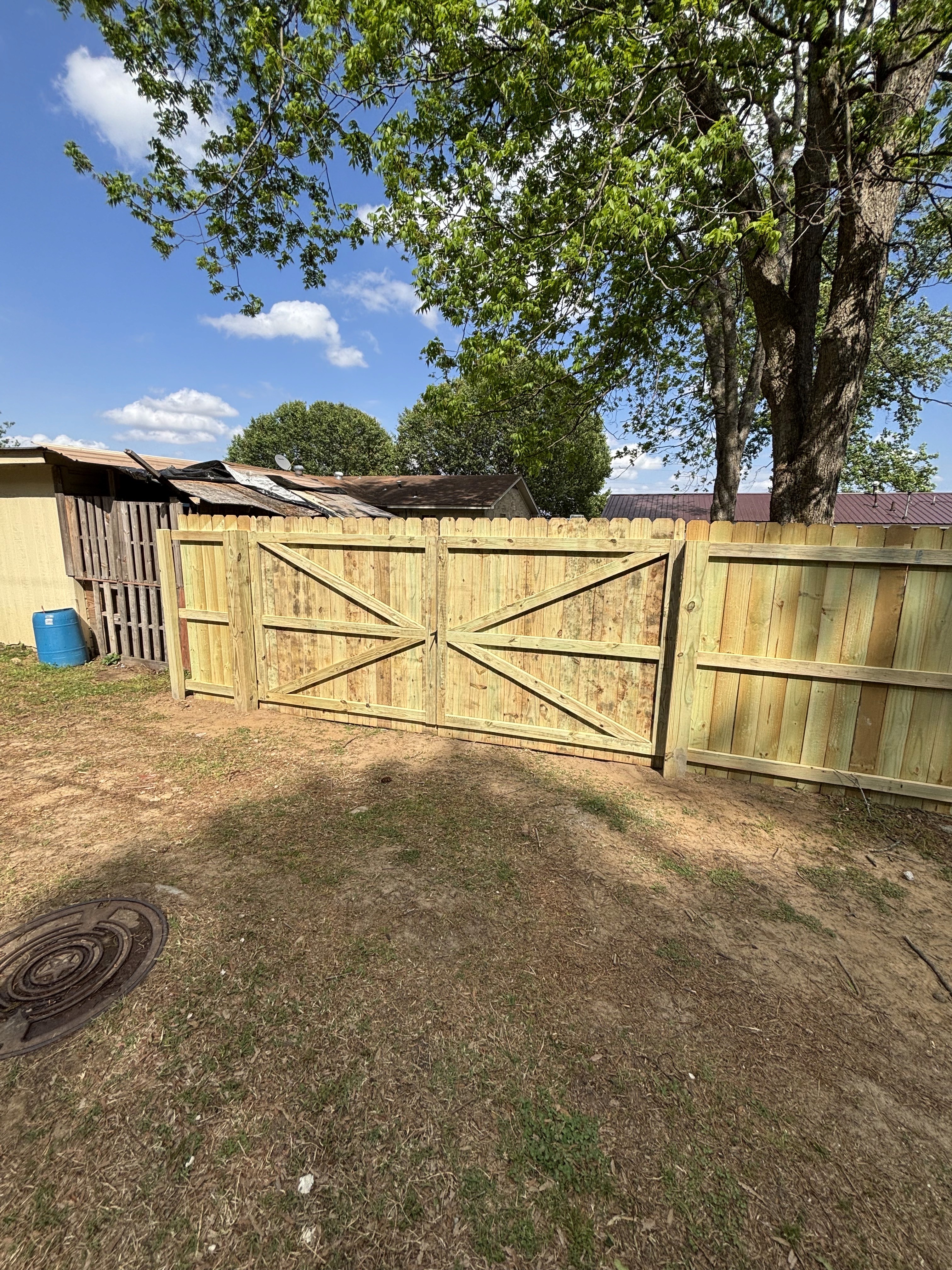 Completed Cornerstone custom wood drive gate